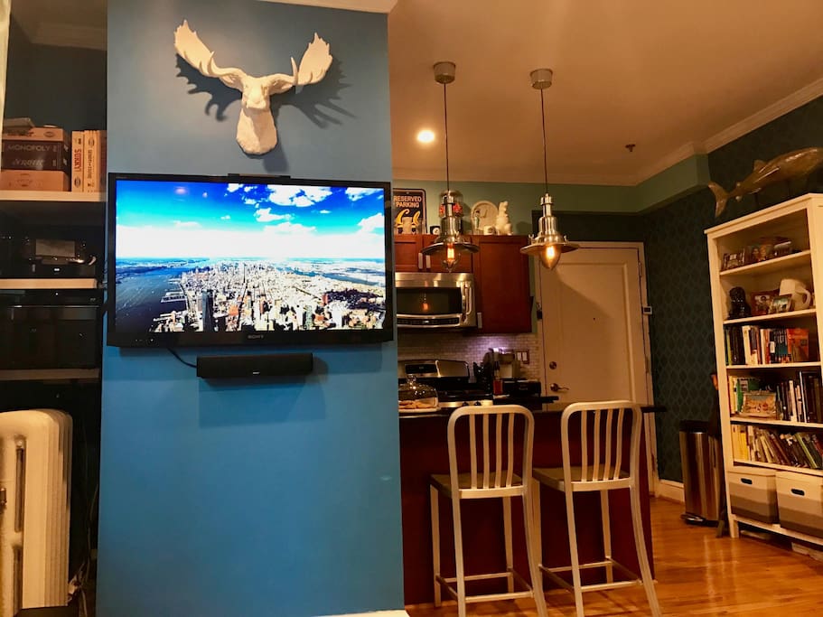 View of Kitchen and Entry from Living Room.