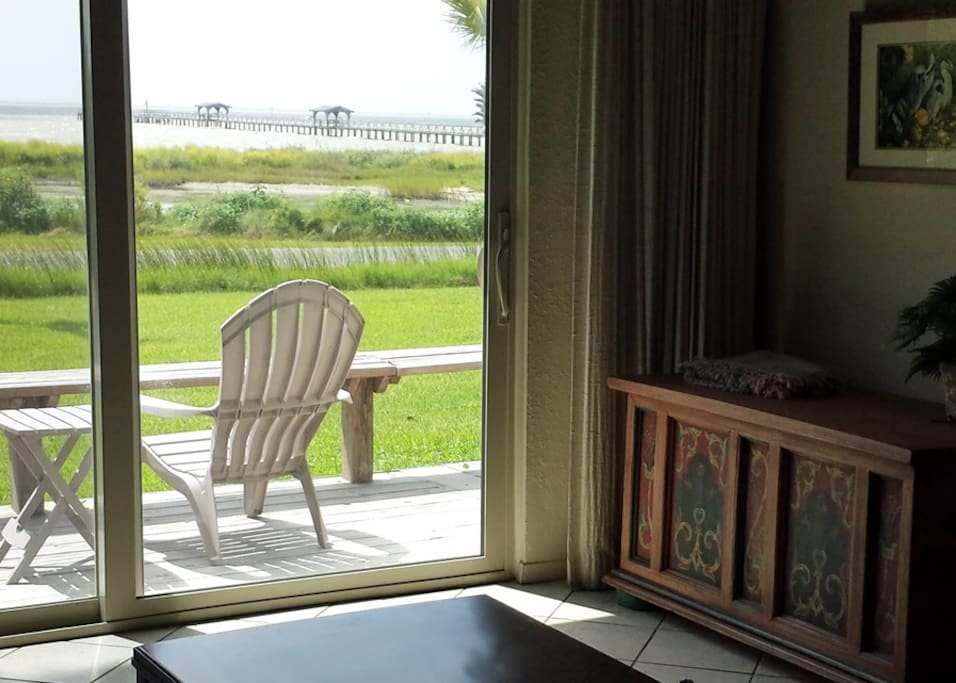 Living room and deck looking out at the bay
