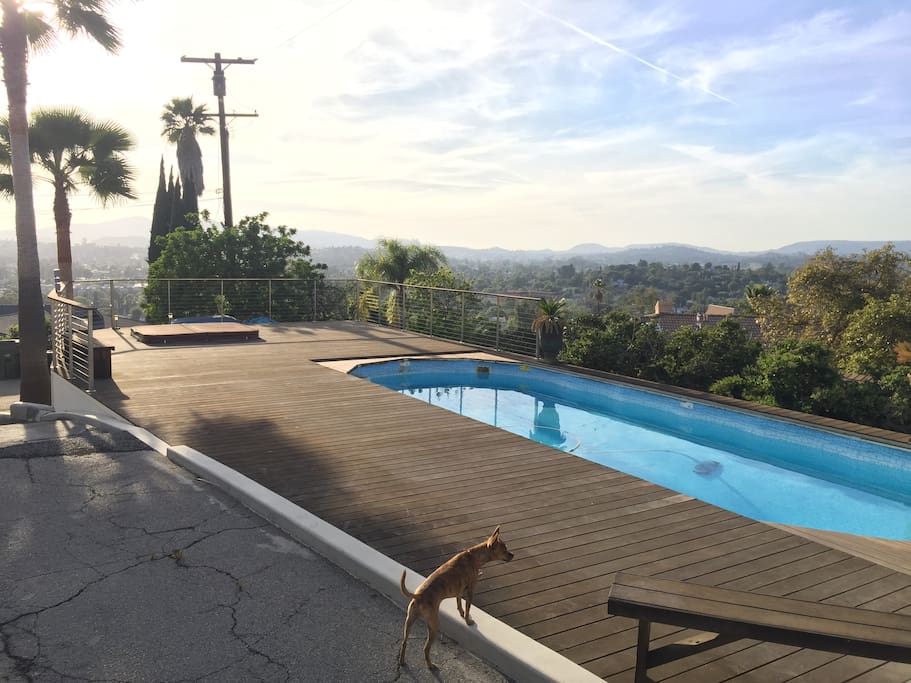 View from deck with pool and hot tub