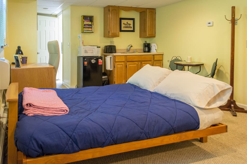 Futon folded out as a bed. The mattress is very thick and the frame is solid wood. The dimensions are the same as a standard full size mattress.