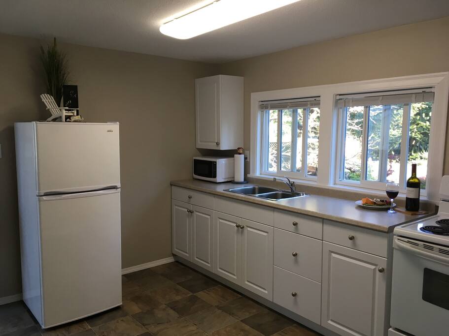 Bright clean well stocked kitchen