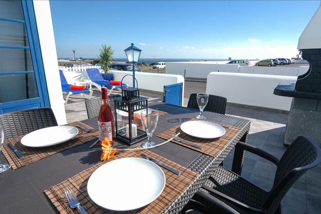 Outside dining with bbq, sunbeds and sea views