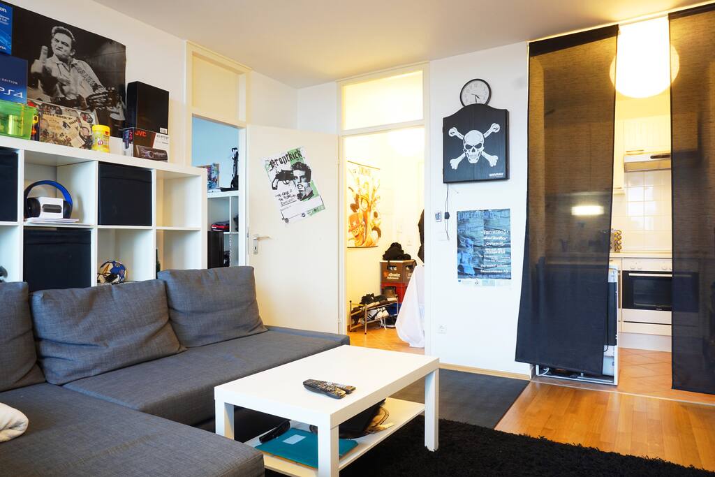 The living room is directly connected to the kitchen.
