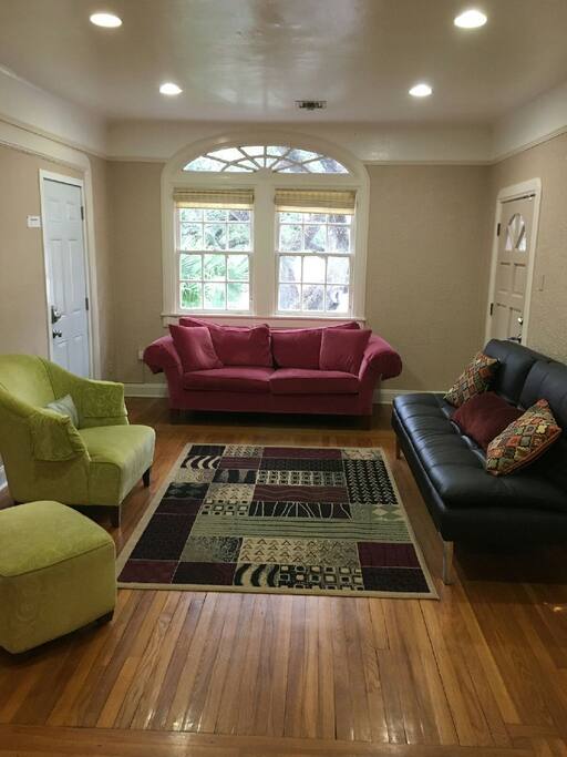 Living Room, the black futon couch makes into a full size bed.