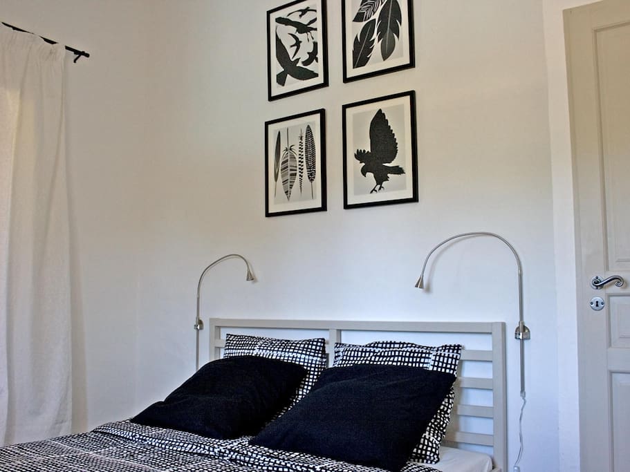 Bedroom with large double bed.