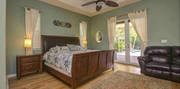 Master Bedroom with king size bed and access to the pool