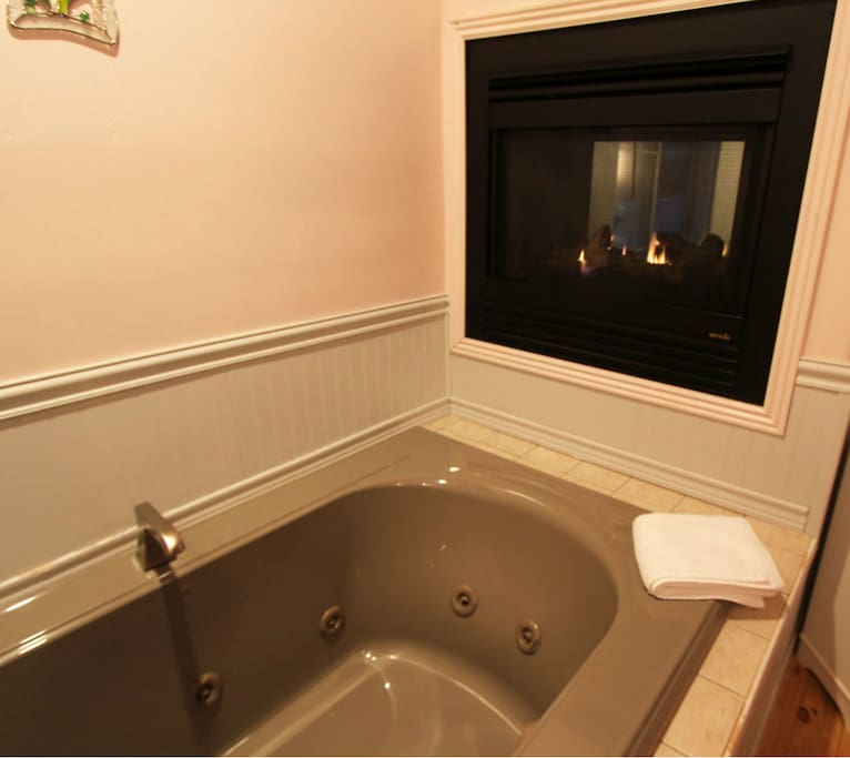 You can enjoy a quiet relaxing whirlpool tub while being warmed by the see through fireplace.