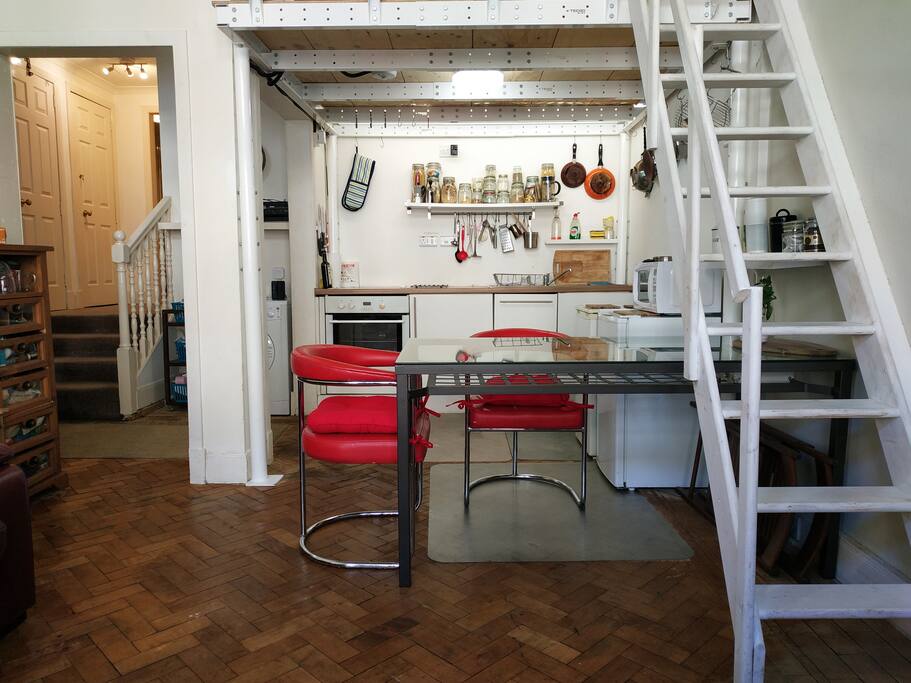 Cute kitchen and dining area with all you need for a small meal or a big dinner.
