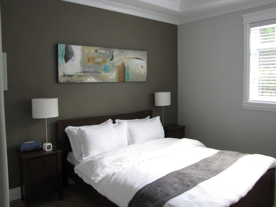 Queen size bed in Deep Cove Room.