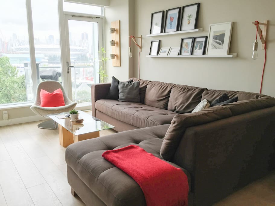 A very comfortable couch. Large windows with lots of natural light.