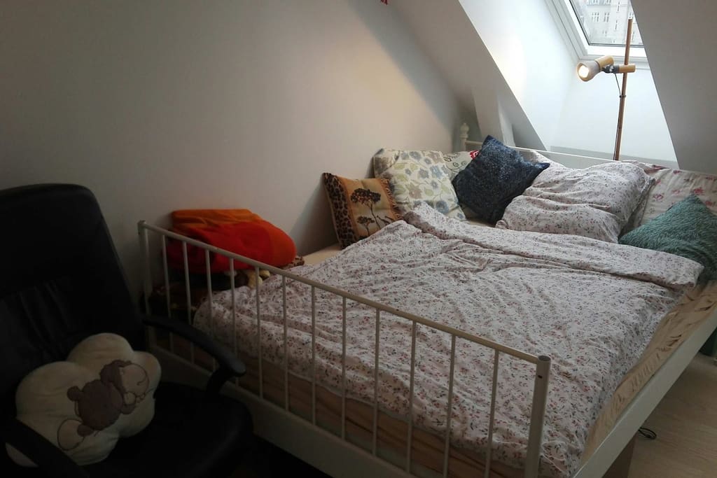 Big double bed under window
