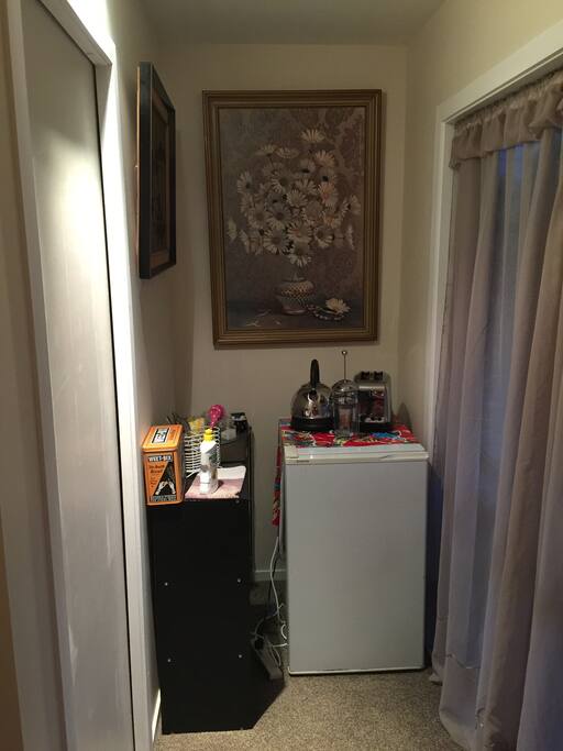 Breakfast nook with fridge,kettle,toaster , crockery and cutlery