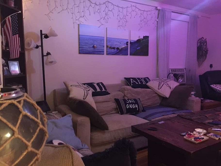 Cozy living room with plenty of places to watch TV or enjoy each others' company.