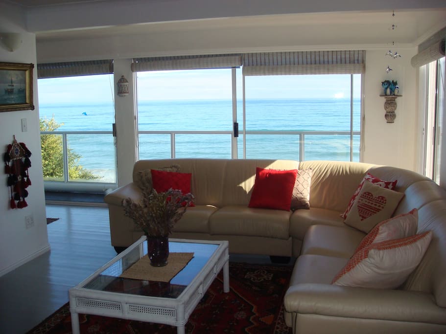 Lounge area on the middle floor leading onto balcony overlooking the ocean