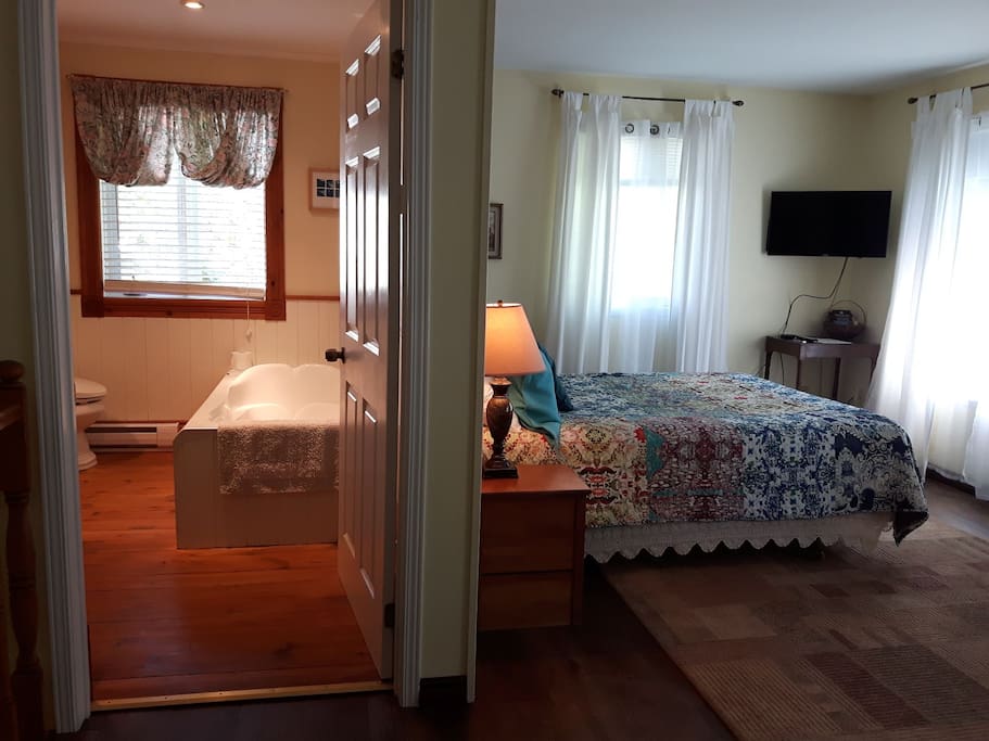 A spacious yet cozy bedroom and spa bathroom are upstairs in a totally private space. Although attached to the main house, there is no connecting door upstairs between this guest suite and the main house. Truly private!