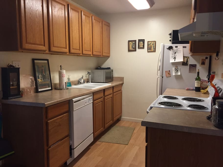 Full kitchen with all inclusive amenities. Dishwasher, fridge, stove, oven, ample counter space, garbage disposal