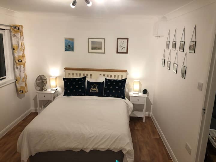 The main bedroom, with views of the garden