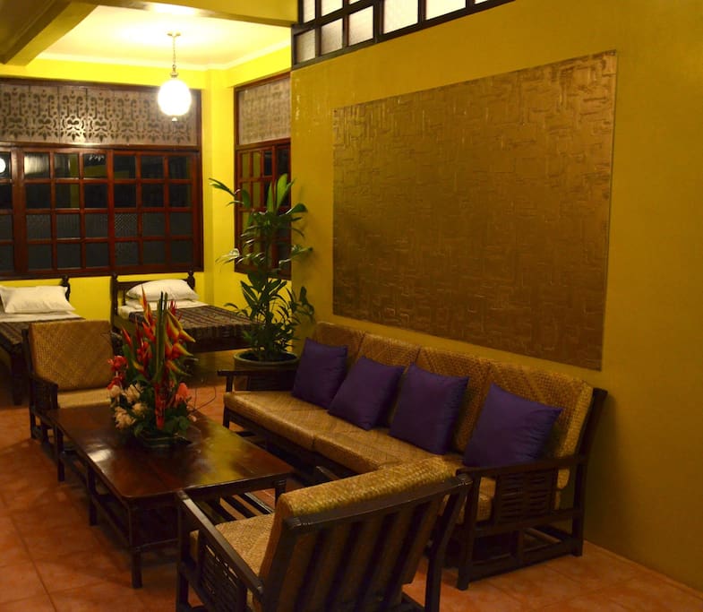 Lounging area with beds at the back