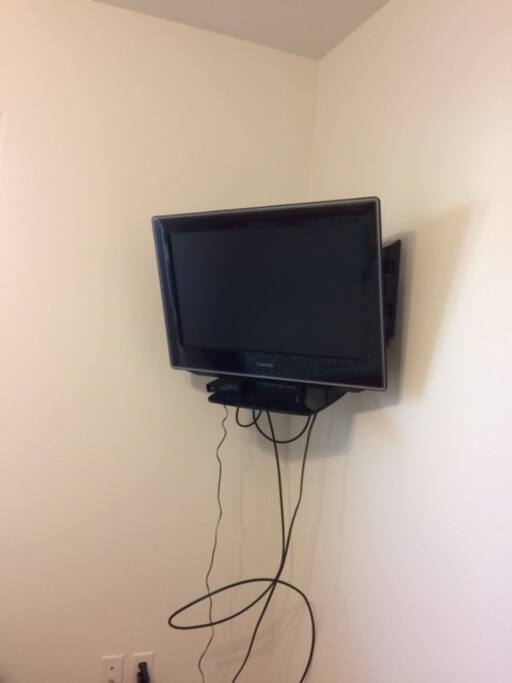 32" colored television with cable and DVD.