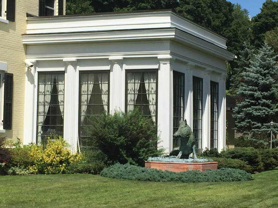 Sunroom from exterior with famous Boar statue.