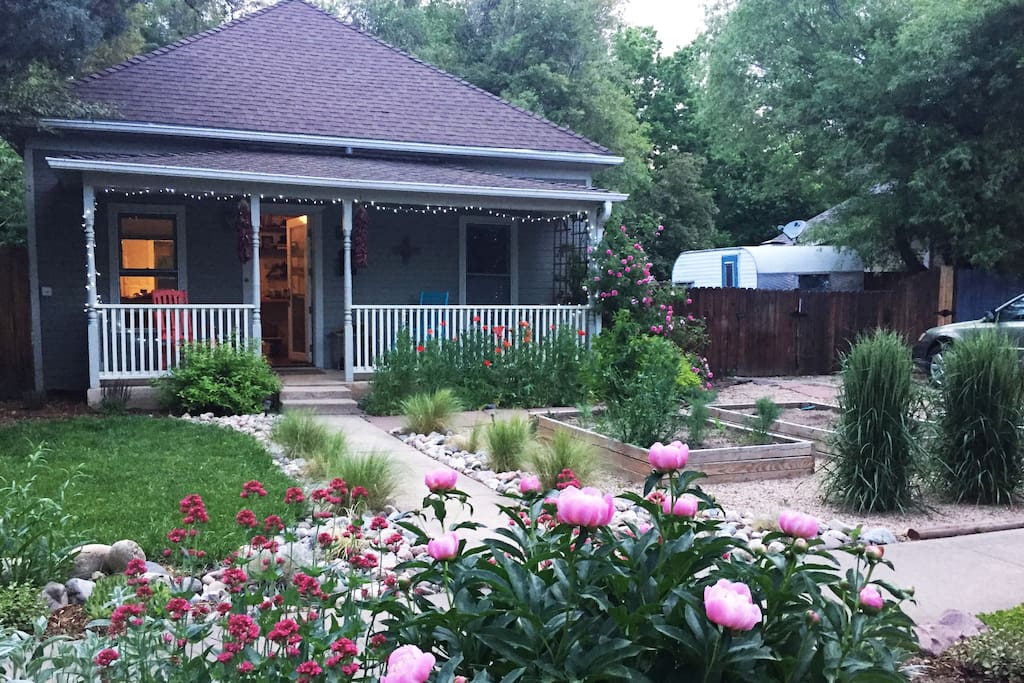 Enjoy the gardens and front porch with rocking chairs.