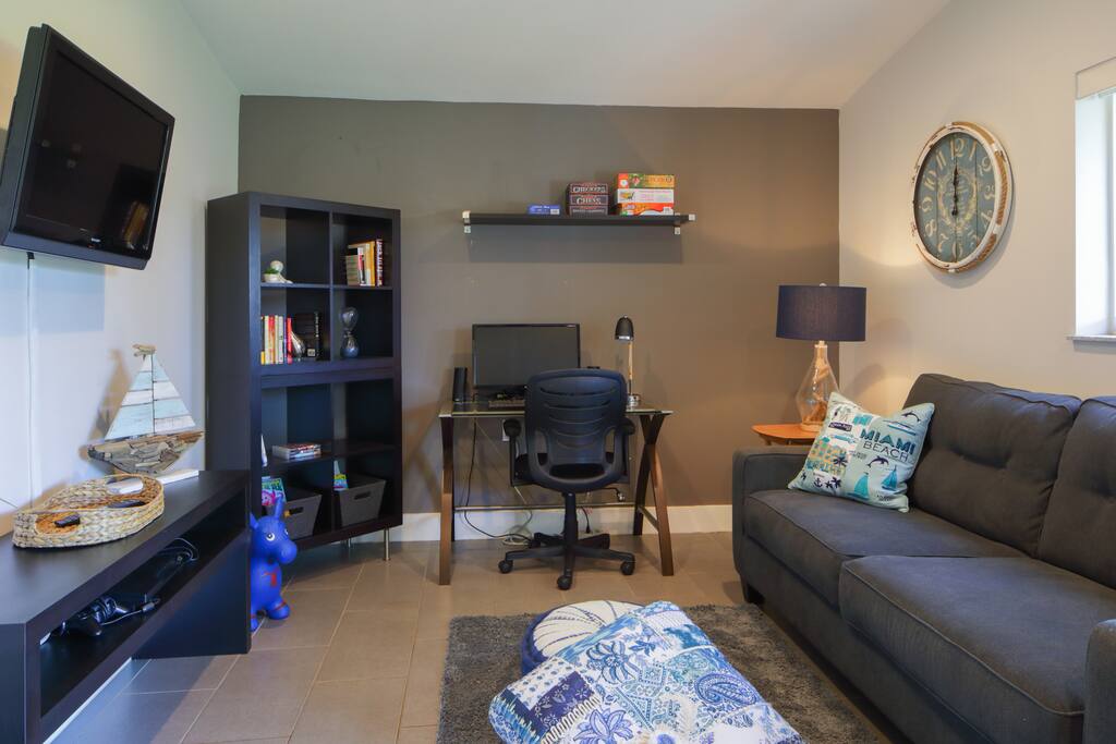 The family room has a Playstation 3, computer peripherals (monitor, keyboard, mouse and printer), and a queen size convertible sofa.
