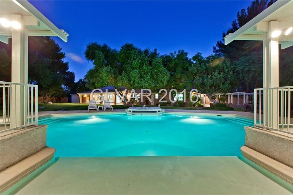 Immaculate backyard BBQ grill, shaded area, games, huge swimming pool, tons of open space, and plenty of seating