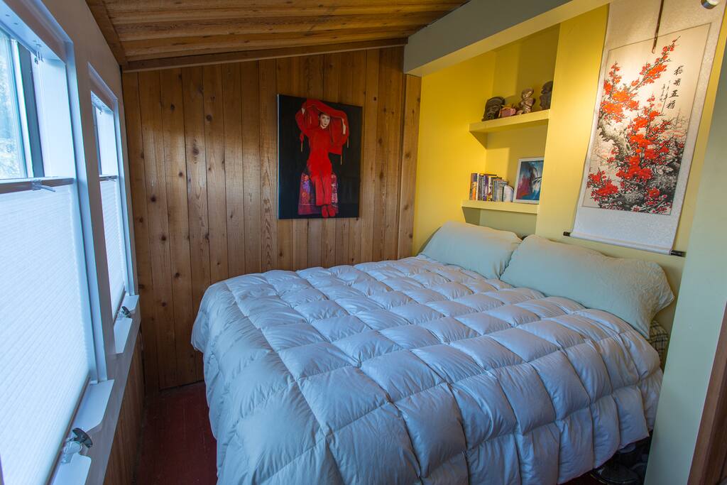 Queen size bed and small but cozy bedroom