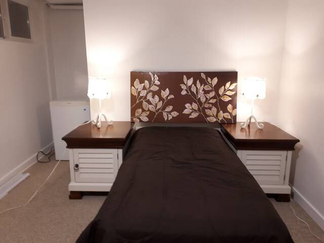 Central Location Bedroom in Renovated Basement.