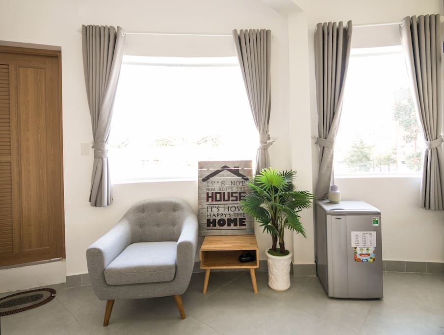 A corner of living room, with city view behind