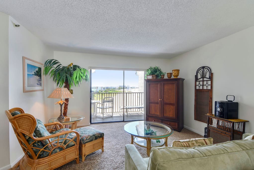 Glass doors lead to the wide balcony from the living area.