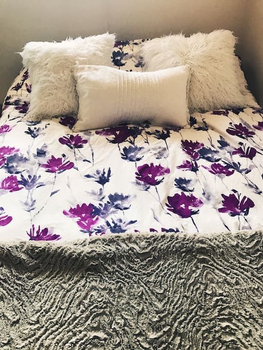 Enjoy a good night rest on our plush queen size bed with tons of extra blankets and pillows!