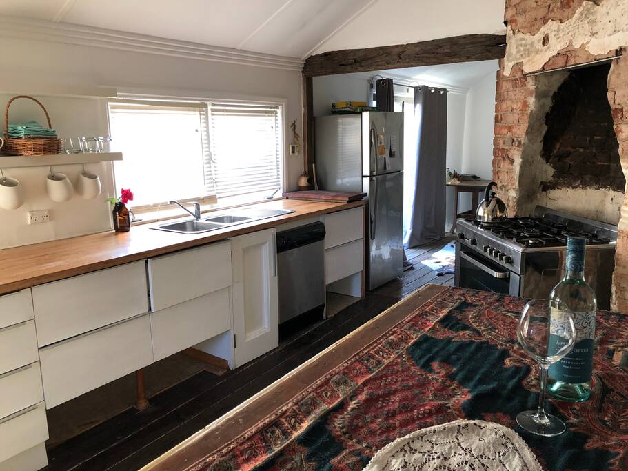 The kitchen space. The windows look over the back yard.