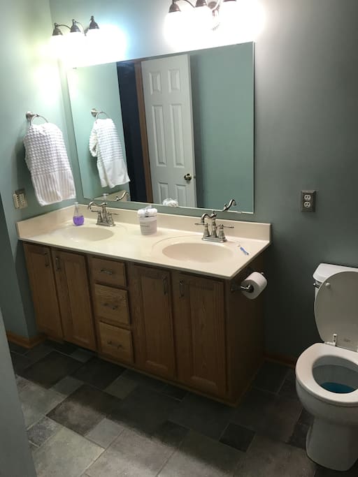 A double sink and one of the bathrooms