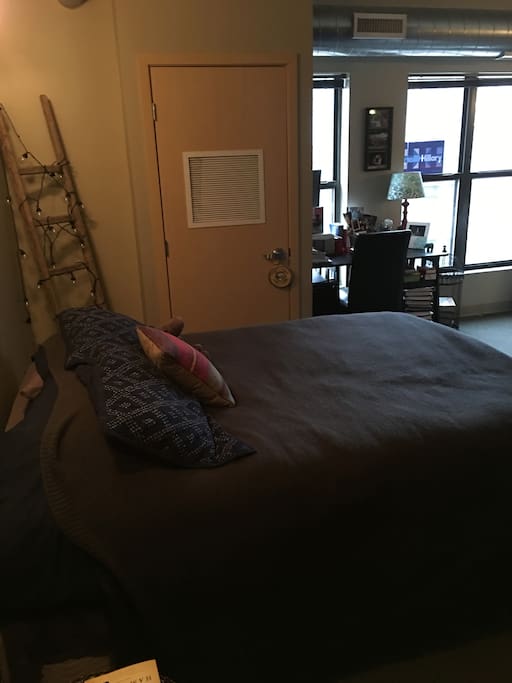 Bedroom with queen-sized, pillow-top mattress plus additional lighting
