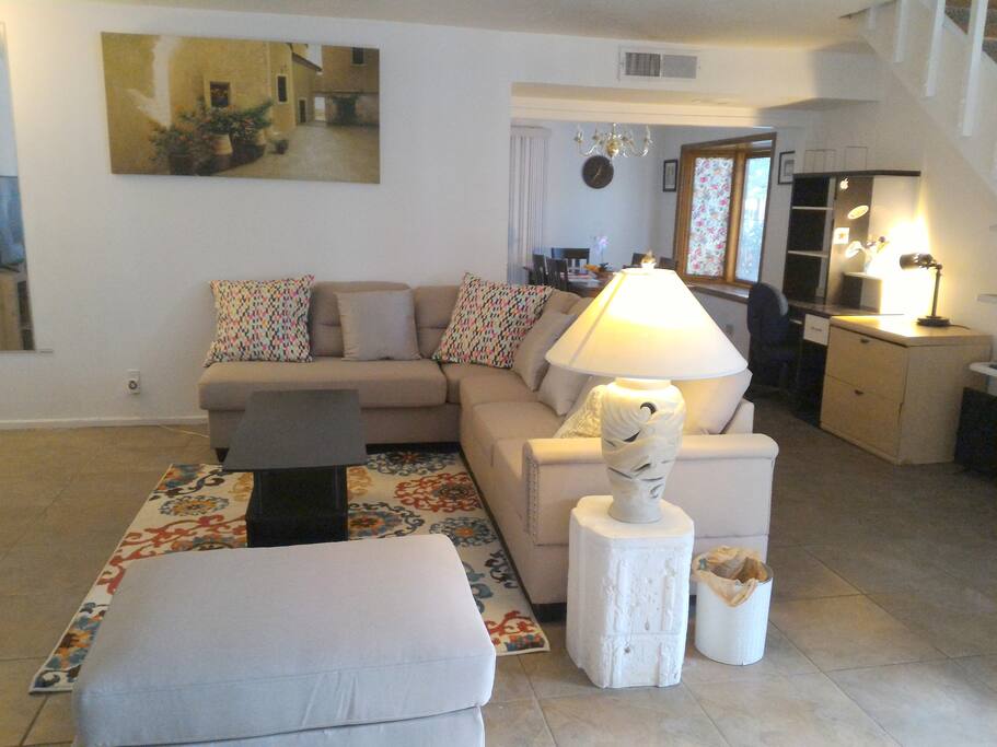 The living room provides a spacious couch