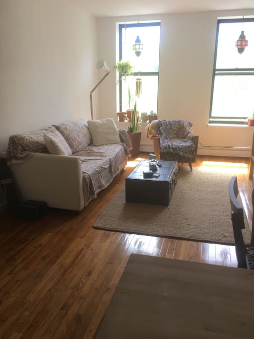 Light-filled, roomy living room. Sleeper couch pulls out to a king sized bed.