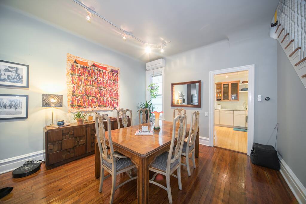 Vintage dining room table, art pieces from Cuba, Kenya, and Philadelphia.
