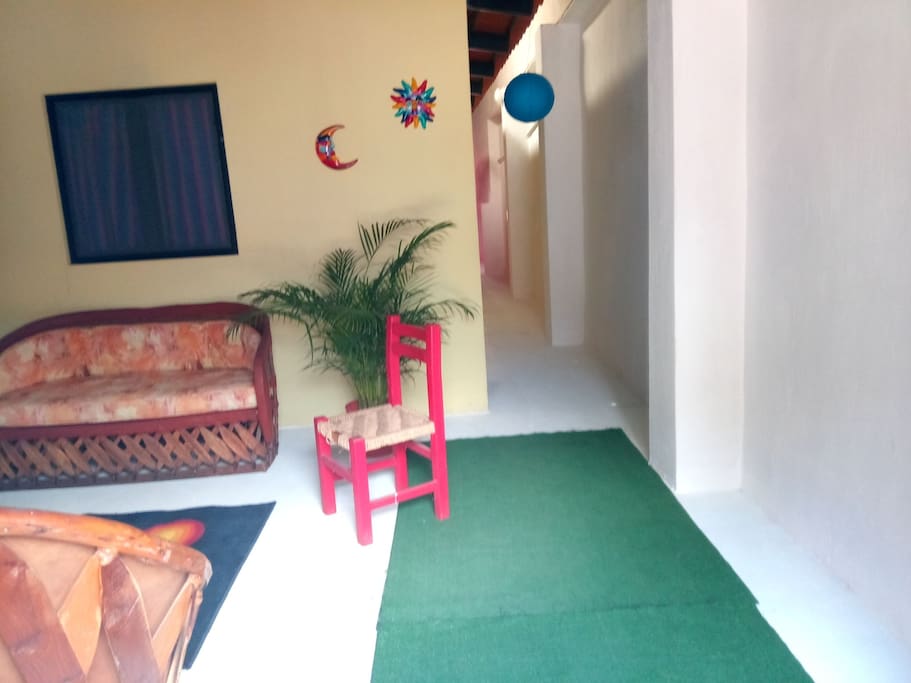 Our beautiful entrance sitting room. Out our front door is 4 blocks to The Plaza or Malecon. Walk 2 blocks to groceries. Walk anywhere you need to go!!