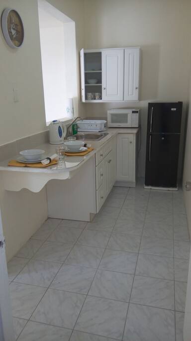 Room 1 Kitchenette with pass through window to Air Conditioned Living room