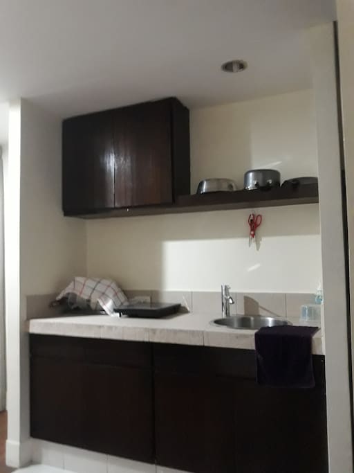 Kitchen with induction stove and utensils