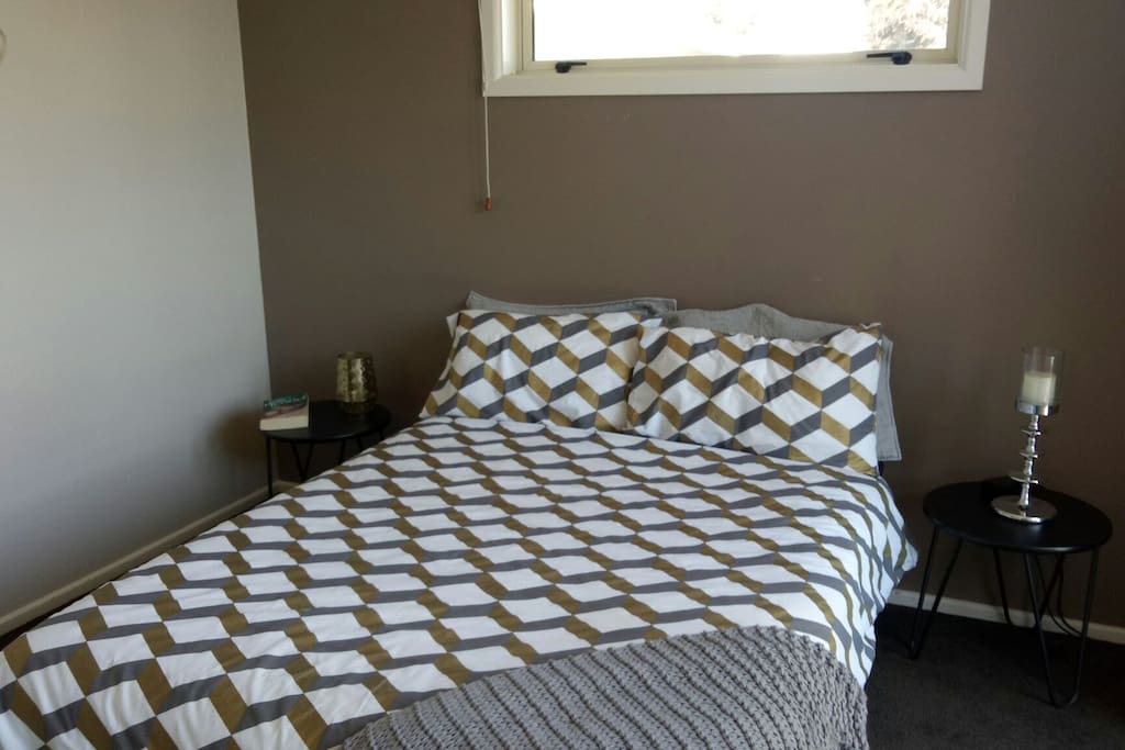 lovely modern bedroom very comfy double bed and French doors opening up to deck
