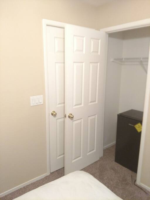 Private Bedroom W/ Mini Refrigerator in the closet. Door enterance behind when closet door is shut.