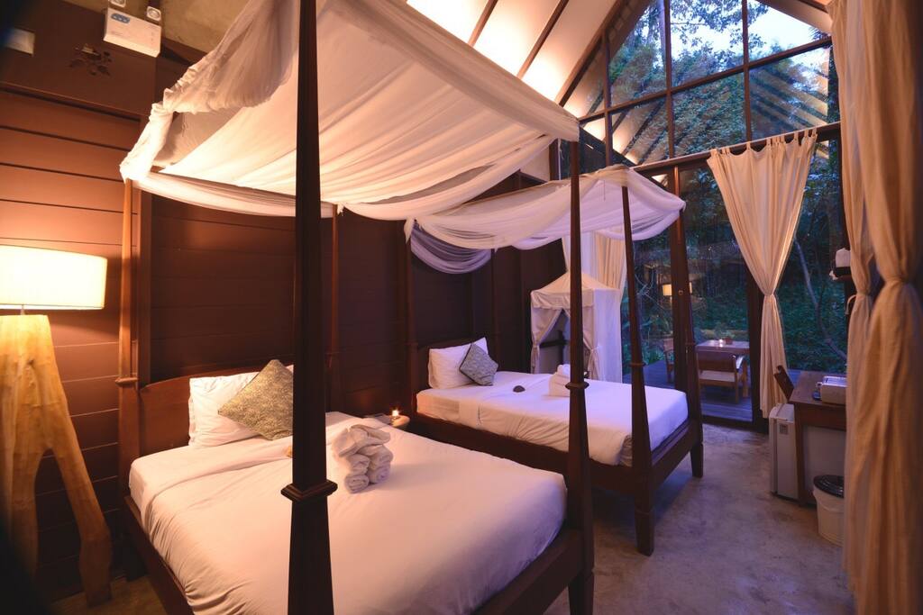 Comfortable two single beds in your private villa.