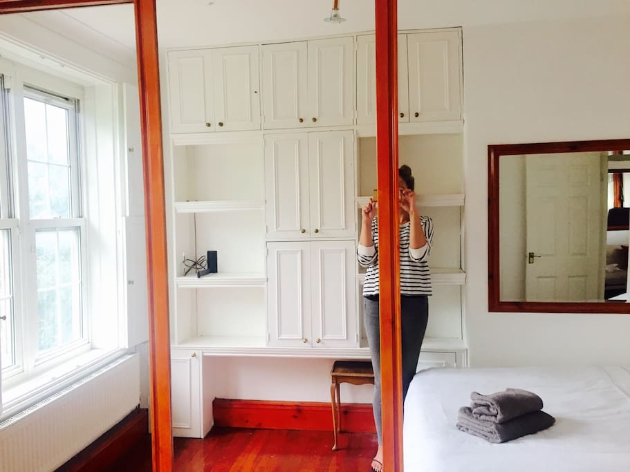 Large mirrored wardrobes with lots of cupboard space