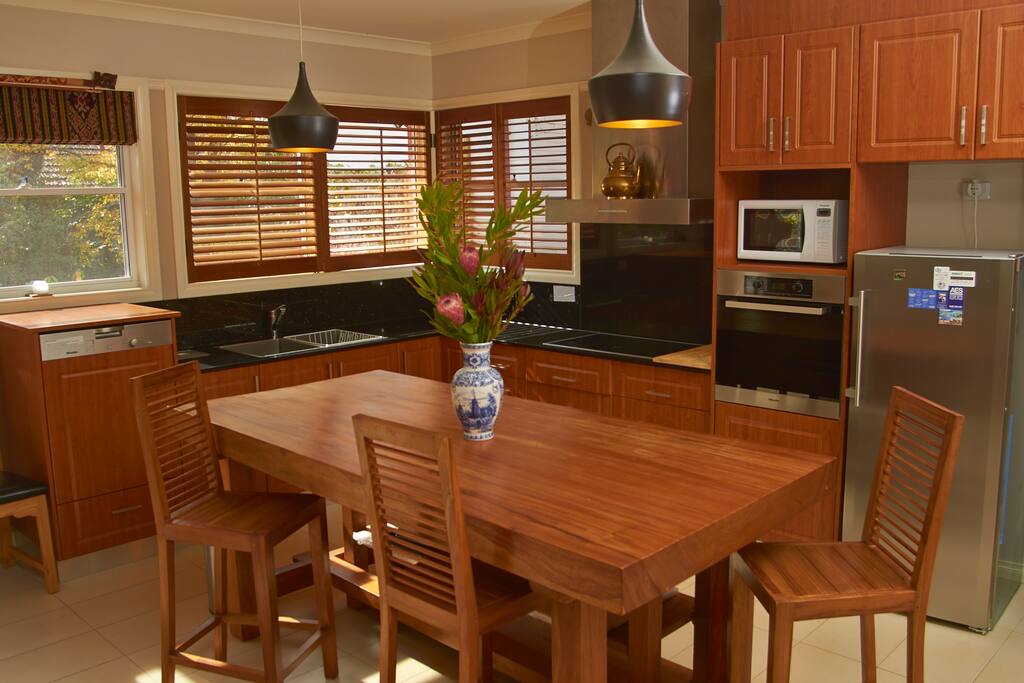 Indonesian timber Bench, bar chairs- some drinks while cooking your meal