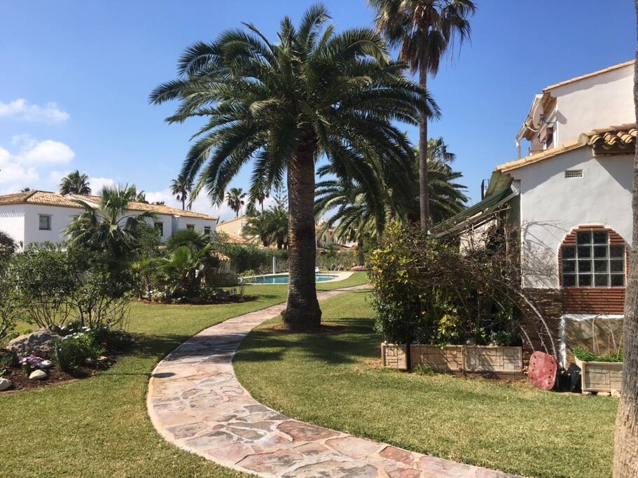 Secure,pretty locked garden with pool and children's pool .short walk across the road from the beach ,view directly looking straight into garden from house