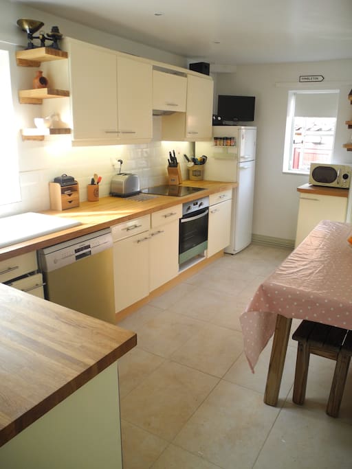 Kitchen with dishwasher, washing machine, induction hob & oven