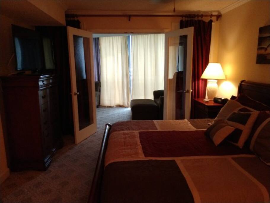 master bedroom king sleigh - wide screen and french doors open to nook