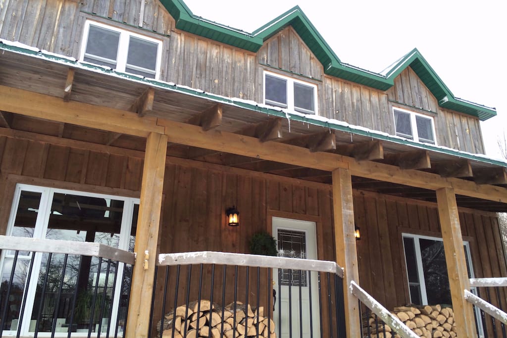 Large open-concept home with guest rooms, living, kitchen, and guest washroom on main floor.